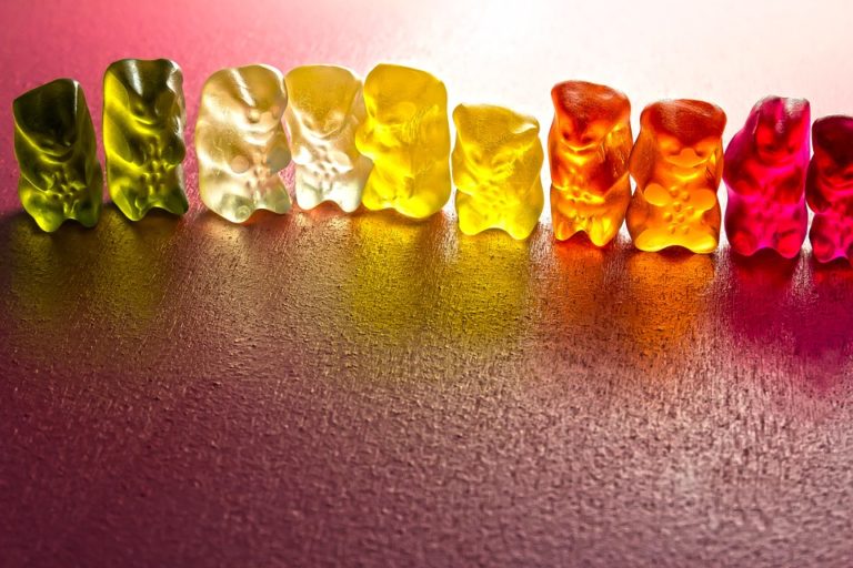 Different colour jelly beans in a line